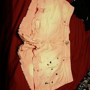 Peach faded and ripped short shorts